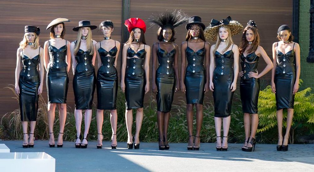 America's next top model contestants wearing leather corsets and dresses from The Stockrooom