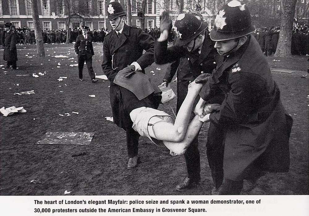 police spanking a protester