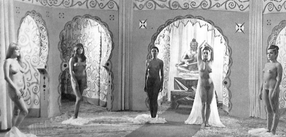 lineup of five naked nude harem girls for inspection in the movie the thousand and one nights and yet another one