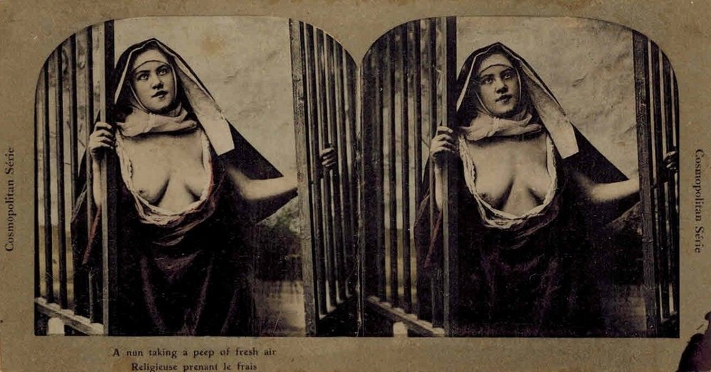 a nun with bare breasts catches a cool breeze at her window