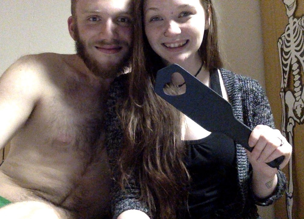 happy couple with spanking paddle
