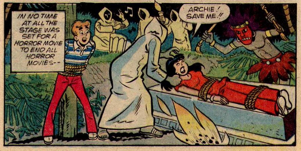 Veronica Lodge tied to a pagan altar while hooded cultists prepare to sacrifice her as Archie watches helplessly while tied to a post
