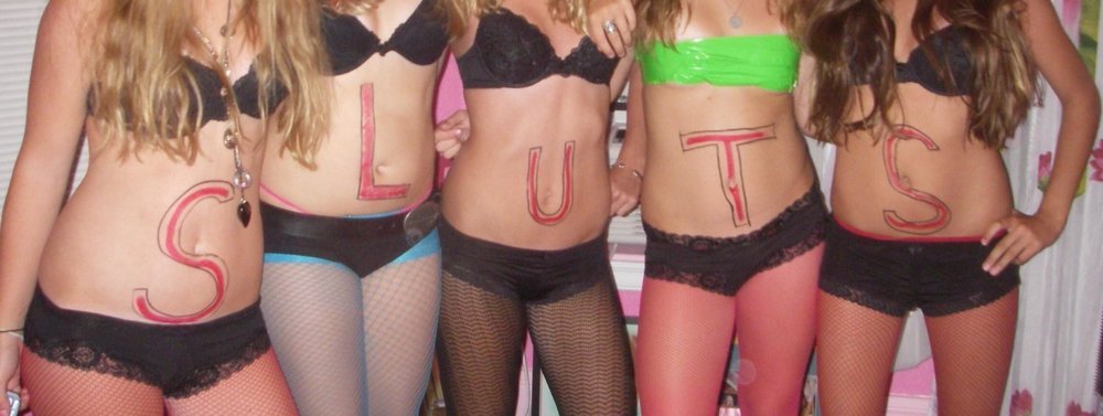five girls in slutty fishnet stockings with writing on their bellies -- one girl with a yellow duct tape bra